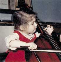 ALT =[“Dr. Jolie Bookspan at age 2 and a half playing the cello: More on Dr. Bookspan's bio web page - http://drbookspan.com/bio] 